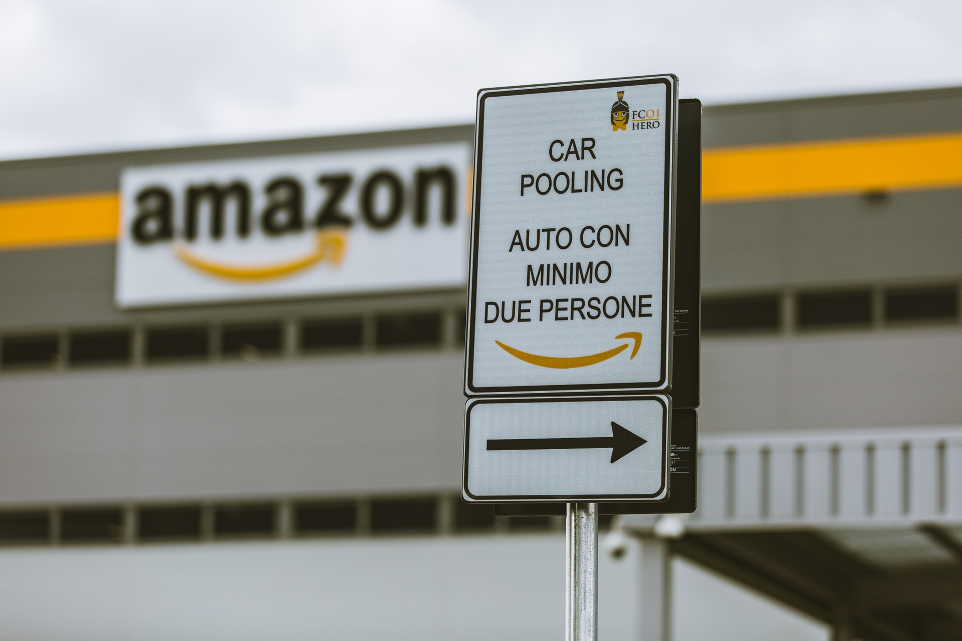 A car pool sign outside of an Amazon fulfillment center in Italy