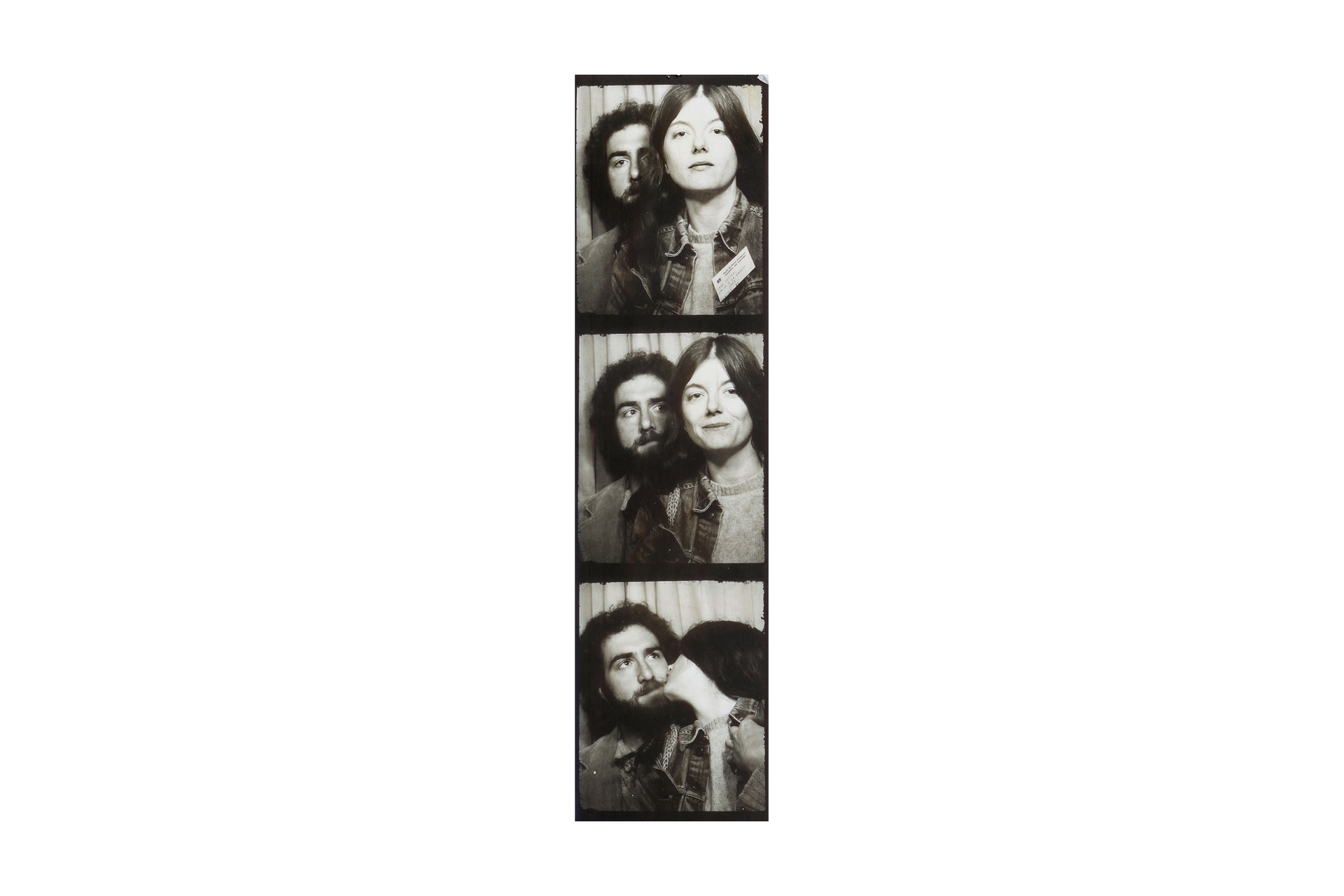 Strip of photo booth images from decades past, with a man and woman, shot in black and white.
