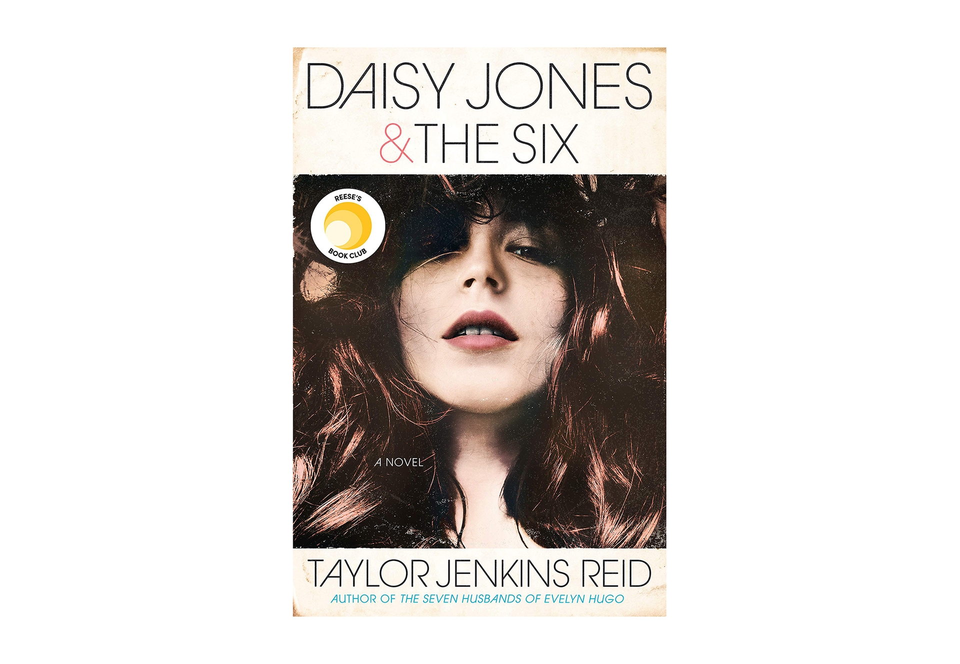 A book cover for "Daisy Jones & the six," a novel by Taylor Jenkins Reid shows a young woman with long dark hair looking downward into the camera. The book background is an age-stained ivory, with all-caps font for the title and author's name.
